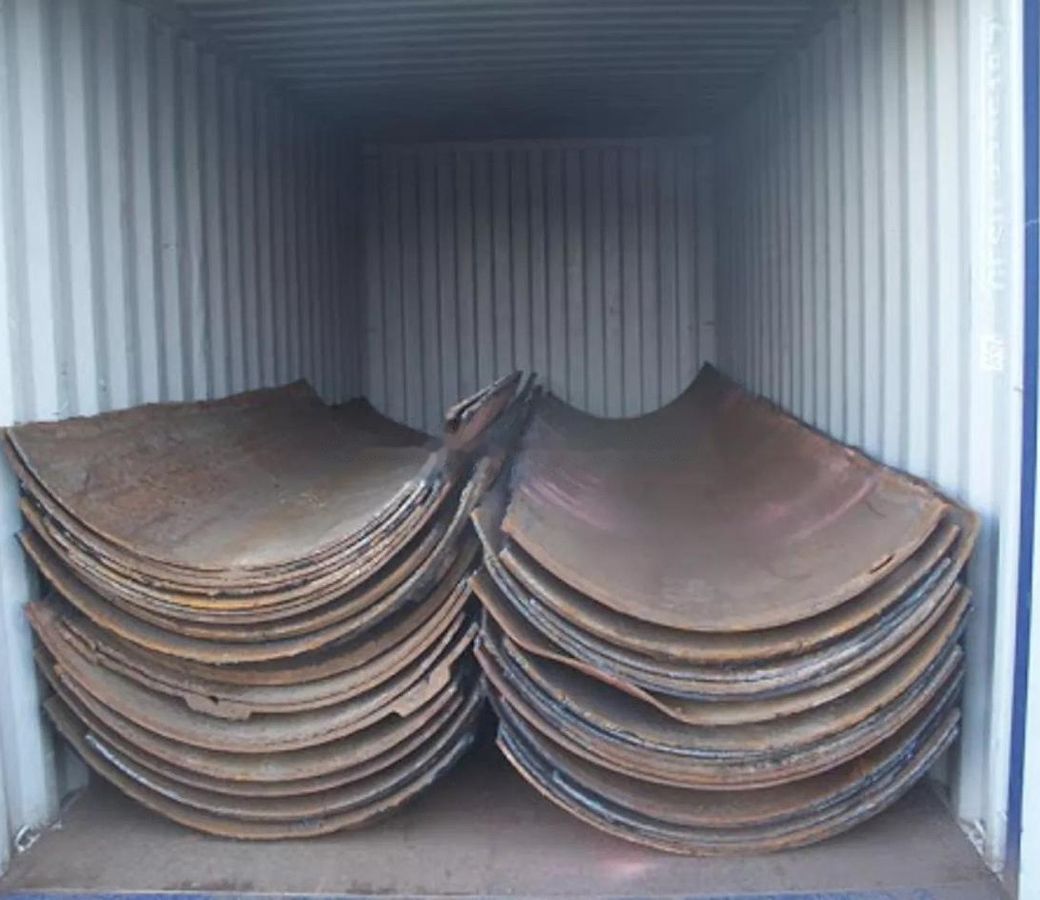 Half-moon cut pipe stacked inside an export container